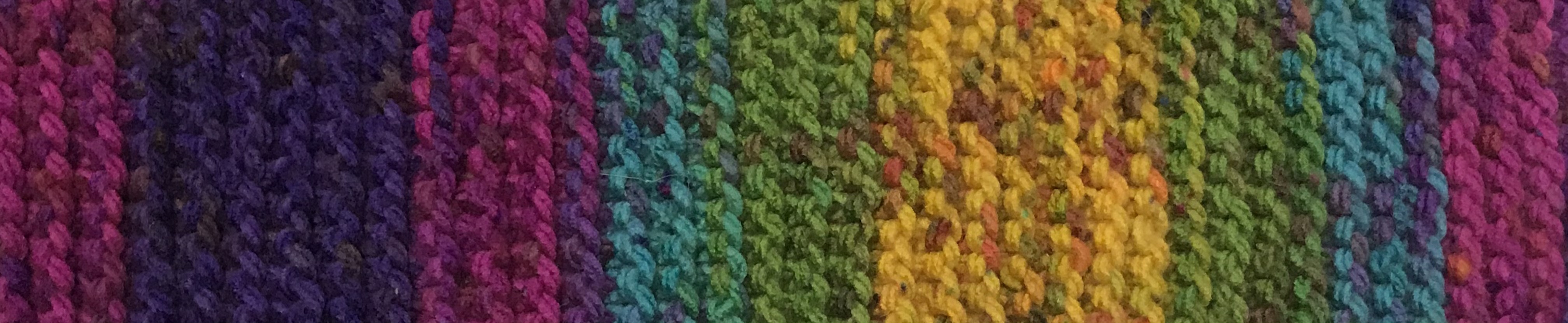 Image of rainbow knit scarf